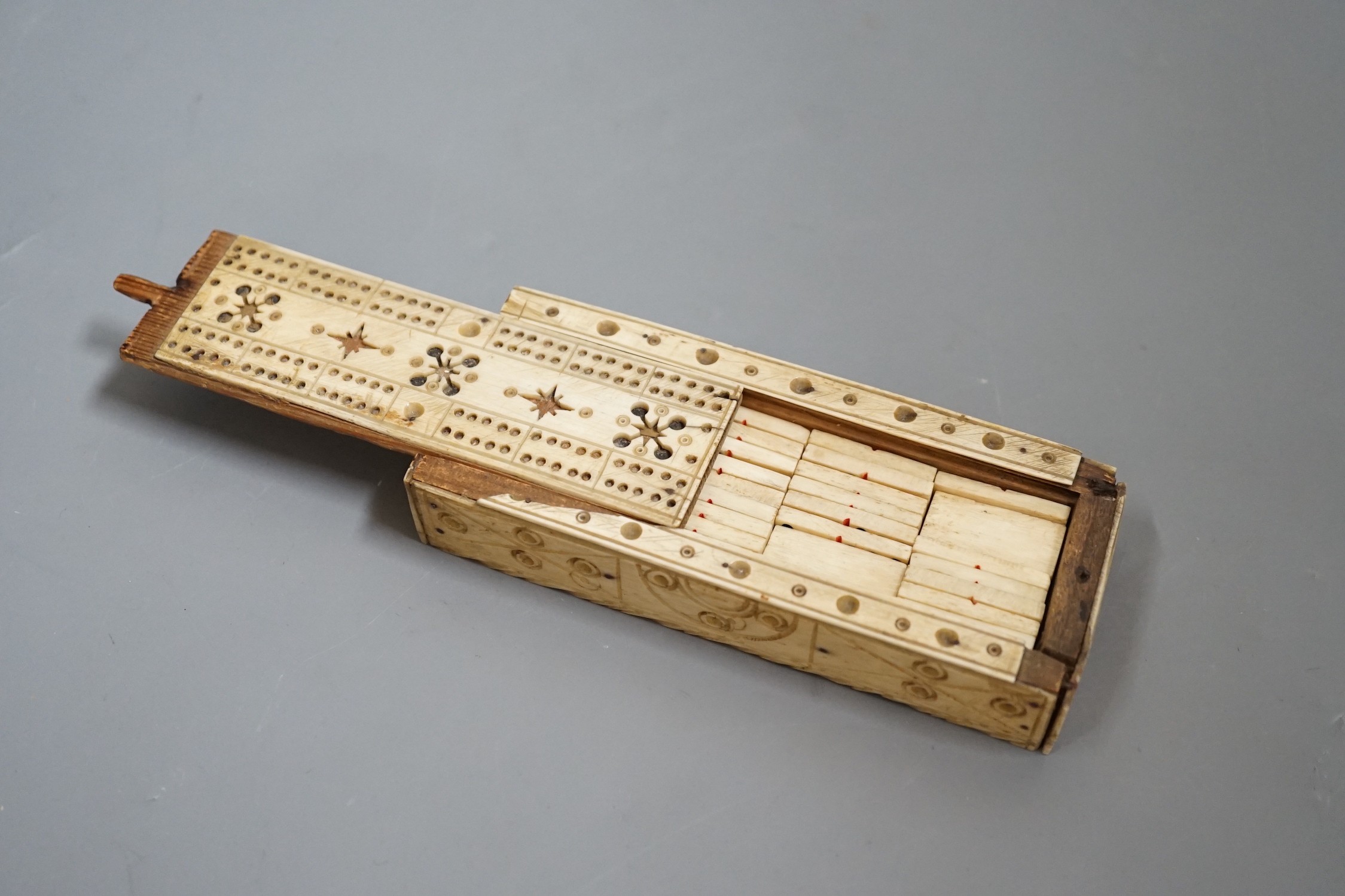 A Napoleonic Prisoner of War bone domino set, box 14cm wide